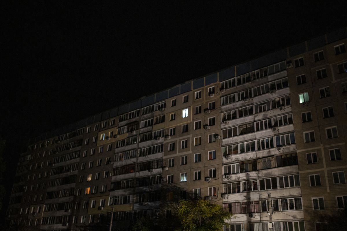 The lights were mostly out at a multistory apartment building in Dnipro, Ukraine, on Saturday, as scheduled power outages took hold across the city. Dnipro is one of the hardest hit cities by Russia