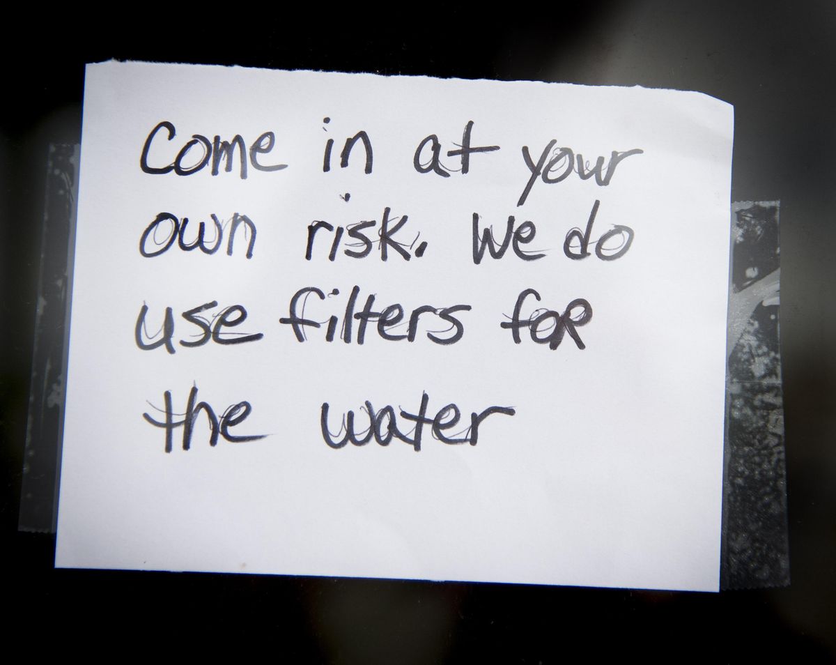 A sign on the entry door to ZipÕs Drive in in Airway Heights gives customers pause before entering. Colin Mulvany/THE SPOKESMAN-REVIEW (Colin Mulvany / The Spokesman-Review)