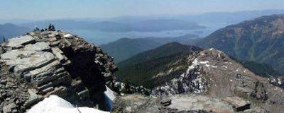 With Lake Pend Oreille sprawling in the background to the south, a group of hikers takes a break on top of 7,009-foot Scotchman Peak, the highest point in Bonner County.
(The Spokesman-Review)