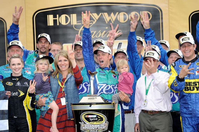 Matt Kenseth, driver of the #17 Zest Ford, celebrates with his wife Katie and their family in Victory Lane after winning the NASCAR Sprint Cup Series Hollywood Casino 400 at Kansas Speedway on October 21, 2012 in Kansas City, Kansas. (Photo Credit: John Harrelson/Getty Images) (John Harrelson / Getty Images North America)
