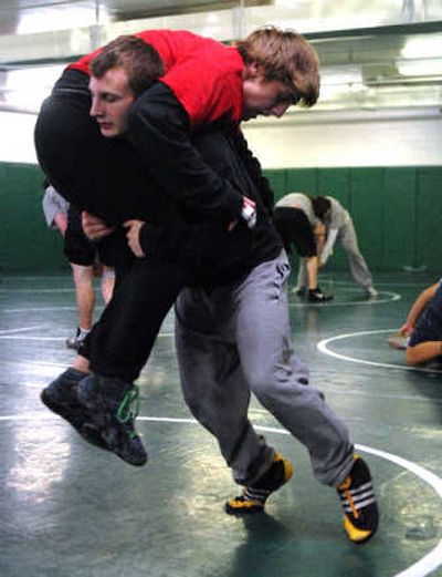 
Matt Mehlbrech lifts a teammate during a drill at practice at East Valley High School.
 (Liz Kishimoto / The Spokesman-Review)