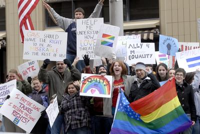 Advocates of gay marriage chant and cheer passing cars Saturday in front of Spokane City Hall.  (Jesse Tinsley / The Spokesman-Review)