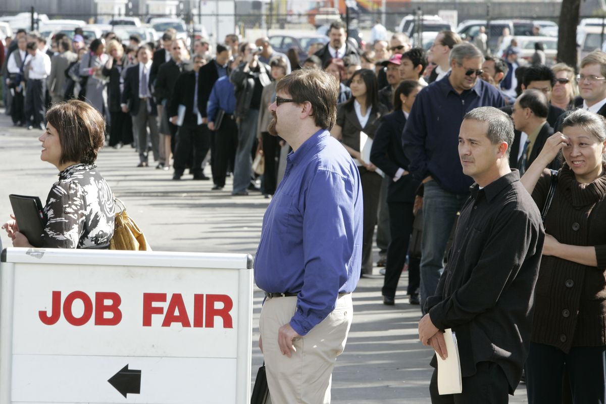 Hundreds of people wait in line to get into a job fair presented by Jobs & Careers Newspaper and Job Fairs in San Mateo, Calif., in this February photo.  (File Associated Press)
