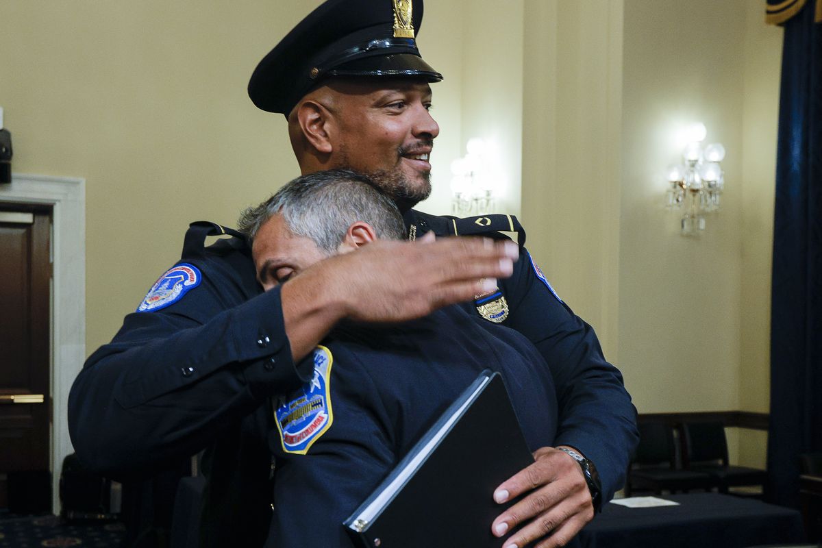 U.S. Capitol Police Sgt. Harry Dunn hugs Washington Metropolitan Police Department officer Michael Fanone after a House select committee hearing on the Jan. 6 attack Wednesday on Capitol Hill in Washington.  (Jim Bourg)
