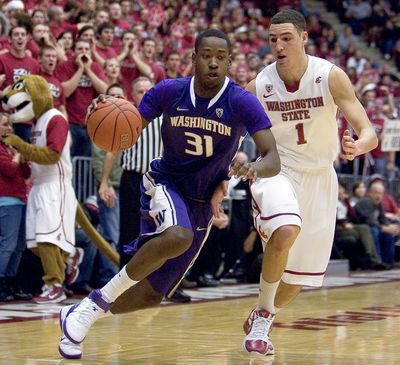 Washington guard Terrence Ross (31) drives against Washington State guard Klay Thompson (1) during the first half of an NCAA college basketball game Sunday, Jan. 30, 2011, in Pullman, Wash. Washington State won 87-80. (Dean Hare / Fr158448 Ap)