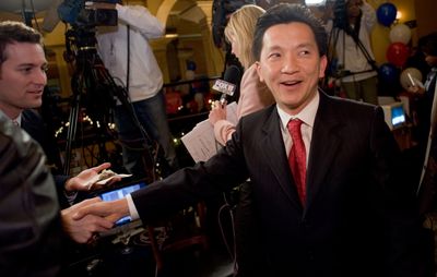 Anh “Joseph” Cao is greeted by a reporter in New Orleans as early returns Saturday show him winning against U.S. House incumbent William Jefferson.  (Associated Press / The Spokesman-Review)