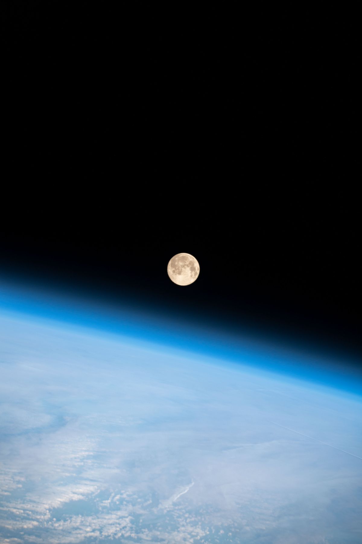A full moon is pictured above the Earth’s horizon on Feb. 26 as the International Space Station orbited 263 miles above the Washington-Oregon border.  (NASA)