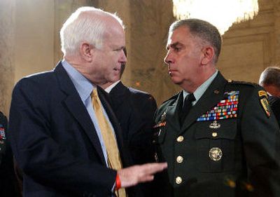 
Gen. John Abizaid, chief of the U.S. Central Command, listens to Sen. John McCain, R-Ariz., at the hearing.  
 (Associated Press / The Spokesman-Review)