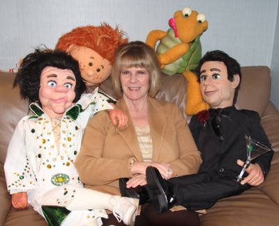 Mary Lien poses with more than $100,000 worth of puppets owned by ventriloquist Terry Fator. (Michael Guilfoil)