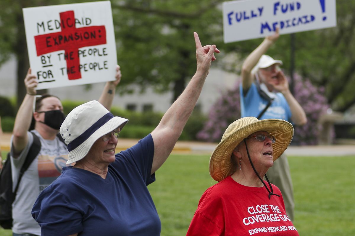 Maxine Horgan, left, and Barbara Nyden repeat the final chant of the Tuesday, April 27, 2021, Medicaid expansion rally at the Missouri State Capitol in Jefferson City. The Missouri Legislature is the latest statehouse fighting to undo voter-backed ballot measures. Missouri