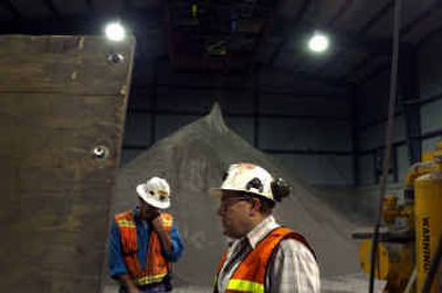 
Pend Oreille Mine manager Mark Brown shows one of his finished products – a powdered zinc that will be hauled to Trail, B.C. and fed into Teck Cominco Ltd.'s smelter. 
 (Jed Conklin / The Spokesman-Review)