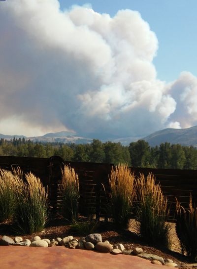 Okanogan County officials are evacuating the entire cities of Twisp and Winthrop because of fast-moving wildfires.