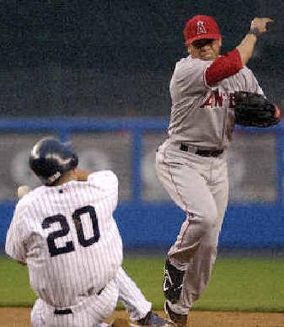 New York's Jorge Posada, falls to the ground after being hit in the face by a ball thrown by Anaheim's  Alfredo. Amezaga.New York's Jorge Posada, falls to the ground after being hit in the face by a ball thrown by Anaheim's  Alfredo. Amezaga.
 (Associated PressAssociated Press / The Spokesman-Review)