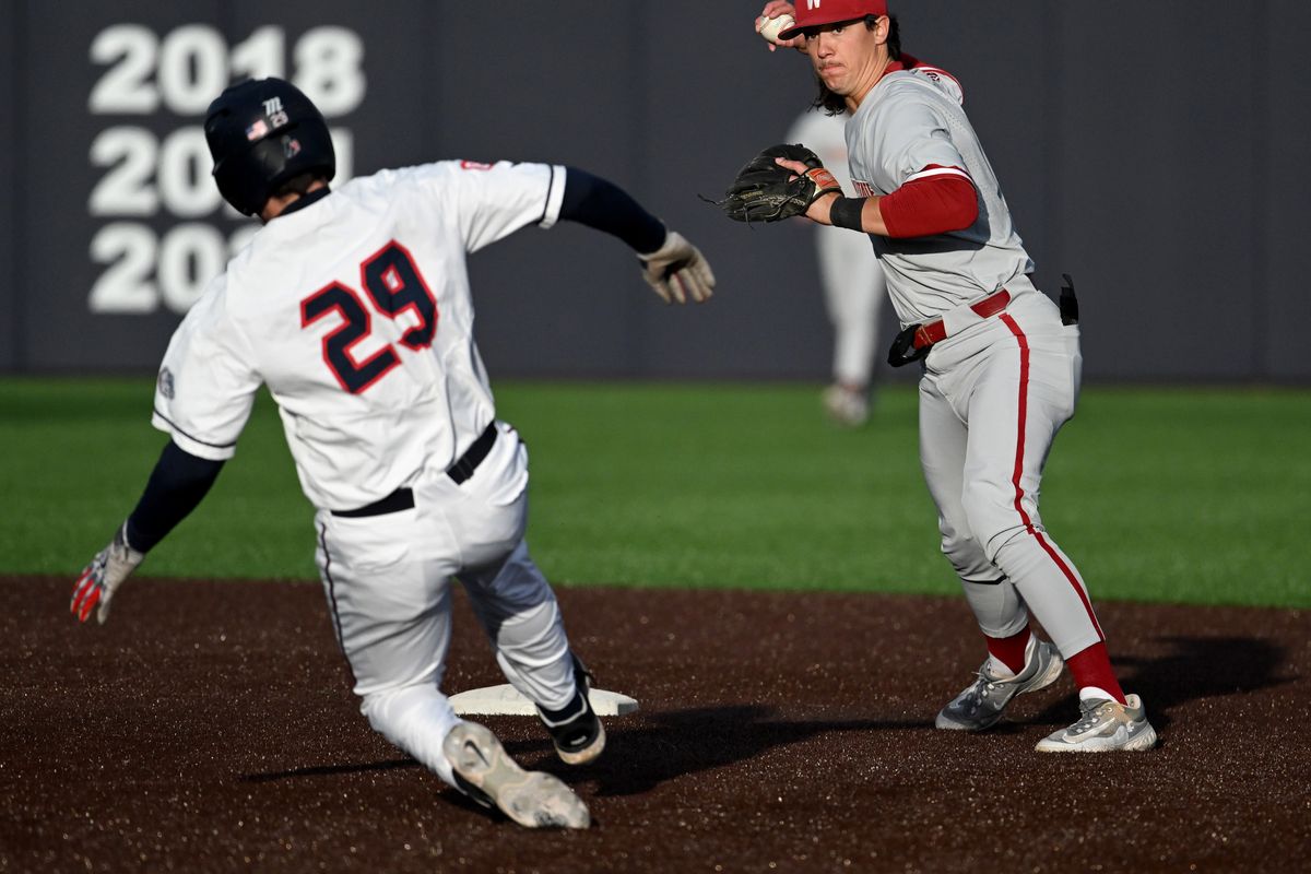 Washington St. infielder Kyle Russell (1) forces Gonzaga infielder Tommy Eisenstat (29) out at second then sends the ball to first base for the double play during an NCAA college baseball game, Tuesday, April 18, 2023, at Gonzaga University  (Colin Mulvany/The Spokesman-Review)