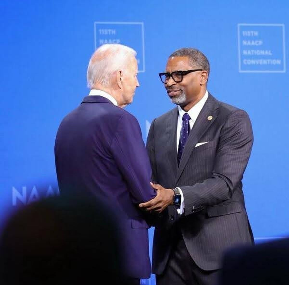 NAACP President Derrick Johnson shakes hands July 16 with President Joe Biden at the NAACP National Convention.  (NAACP)