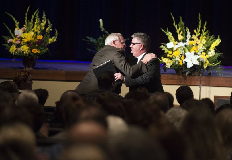 Mike Pearce, husband of the late Anna Patty Duke Pearce, embraces his nephew Mike Kennedy during a memorial service for Duke, April 16, 2016, at Lake City Church in Coeur d'Alene, Id. Kennedy told a humorous story, to the gathering, of when Duke was his landlord. The Academy Award winning actress died at age 69 on March 29, 2016. (Dan Pelle/SR photo)