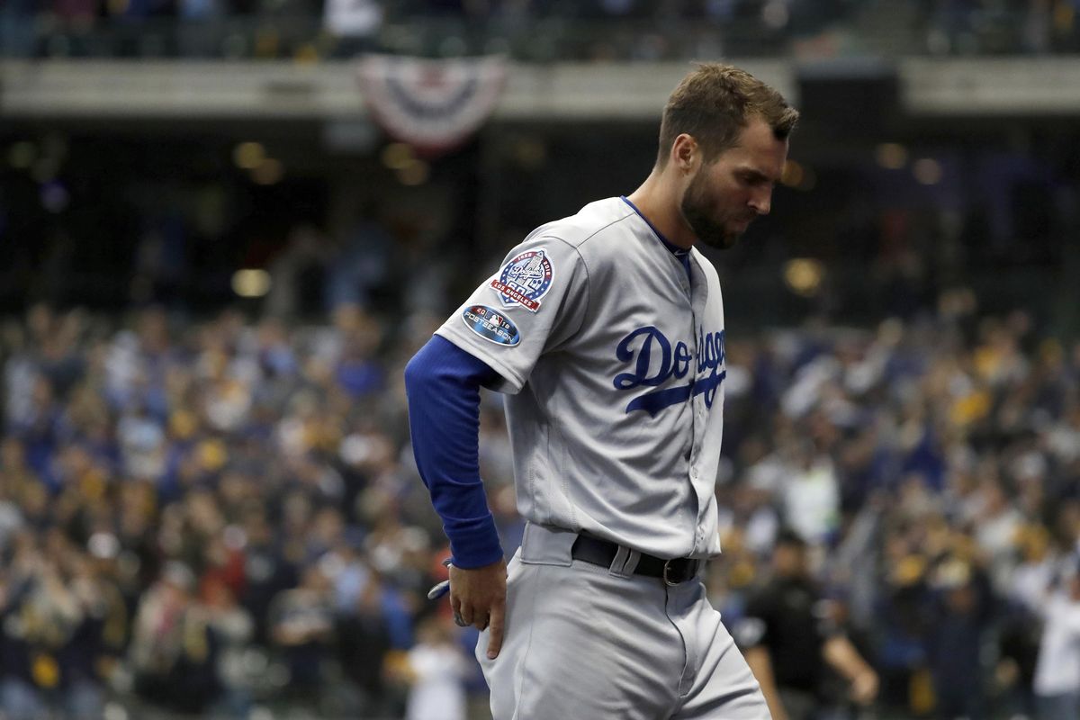 Los Angeles Dodgers’ Chris Taylor  walks off after Game 1 of the National League Championship Series against the Milwaukee Brewers on Friday in Milwaukee. The Brewers won 6-5. (Jeff Roberson / AP)