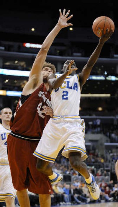 
UCLA's Darren Collison scores on a layup against Robin Lopez. Associated Press
 (Associated Press / The Spokesman-Review)