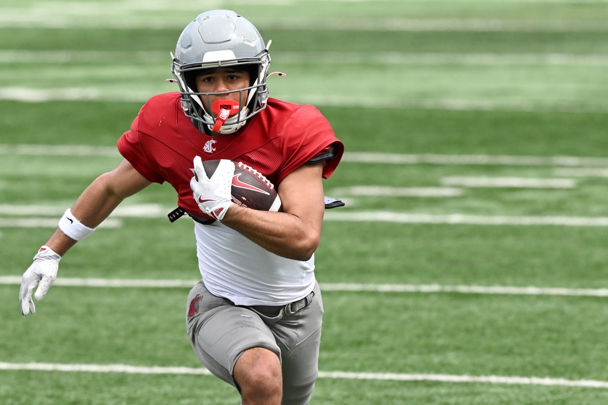 Washington State running back Maxwell Woods carries the ball during a scrimmage on Saturday at Gesa Field in Pullman. Woods, a sophomore, has been on the rise during spring camp.  (Tyler Tjomsland/The Spokesman-Review)