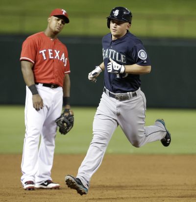 Kyle Seager rounds the bases after his two-run homer. (Associated Press)