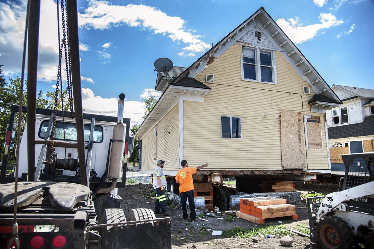 Houses are set to be moved July 11, 2016, at the corner of Gardner and Ash to make room for the new Mega Wash Express in Spokane, Wash. (Dan Pelle / The Spokesman-Review)