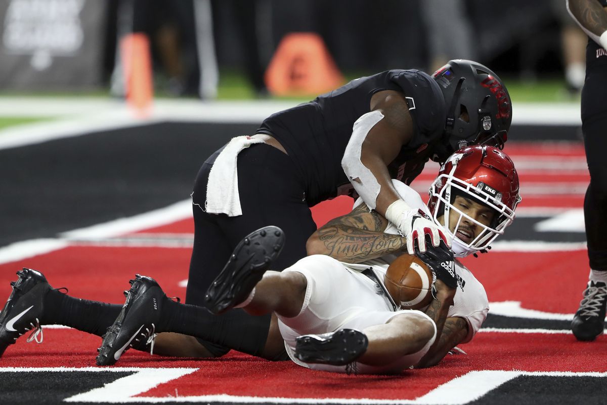 Eastern Washington wide receiver Talolo Limu-Jones lands in end zone after catching a pass for a 2-point conversion, as UNLV linebacker Jacoby Windmon (4) defends during the second overtime of an NCAA college football game Thursday, Sept. 2, 2021, in Las Vegas.  (Associated Press)