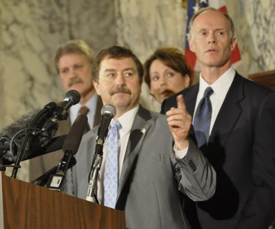 OLYMPIA -- Senate Republican Leader Mark Schoesler of Ritzville answers a question about the new coalition leadership being proposed for the Senate. Sens. Rodney Tom, a Bellevue Democrat who is the proposed majority leader, Sen. Ann Rivers, R-LaCenter and Tim Sheldon, D-Potlatch, are behind Schoesler. (Jim Camden)