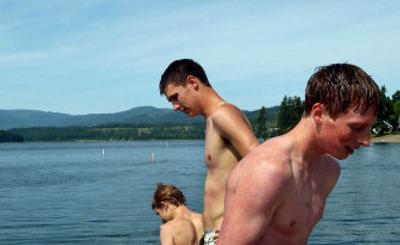 
From left, Kert Whitaker, 15, swims Monday with his brother Trek, 18, and Kyle Neufeld, 15, at Independence Point. 
 (Kathy Plonka / The Spokesman-Review)