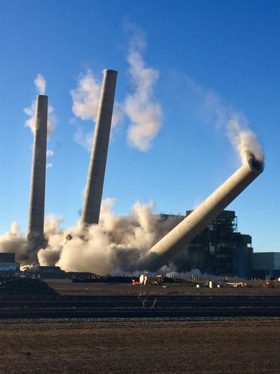 This photo from Dec. 18, 2020, shows the demolitions of the Navajo Generating Station near Page, Arizona. Natural disasters fueled by a warming planet caused record damage according to two new assessments of insurance claims in 2020.  (Associated Press )