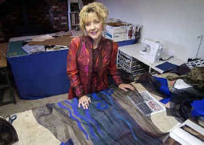 
Artist Laurie Schafer creates wearable art, like the outfit she is wearing. Schafer sells to boutiques nationwide and to private clients. 
 (Liz Kishimoto / The Spokesman-Review)