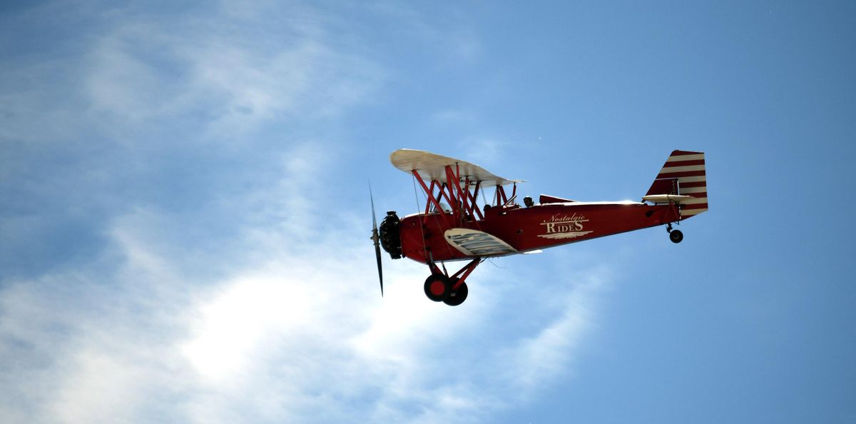 Pilot Mike Carpentiero flies a New Standard 1929 biplane during the 8th annual Felts Field Neighbor Day on Saturday, June 2, 2018. (Kathy Plonka / The Spokesman-Review)