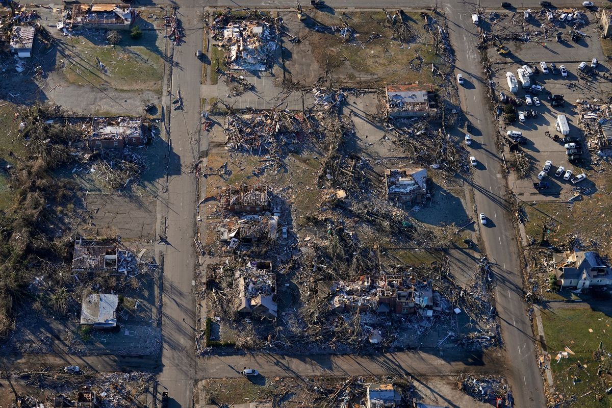 In this aerial photo, destruction from a recent tornado is seen in downtown Mayfield, Ky., Sunday, Dec. 12, 2021.  (Gerald Herbert)