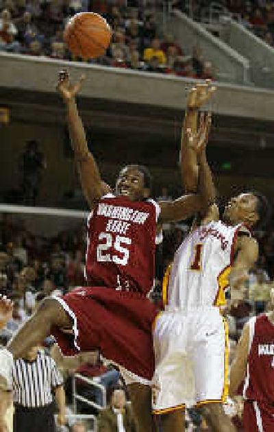 
Kyle Weaver of the Cougars blocks out USC's Nick Young for a rebound.
 (Associated Press / The Spokesman-Review)