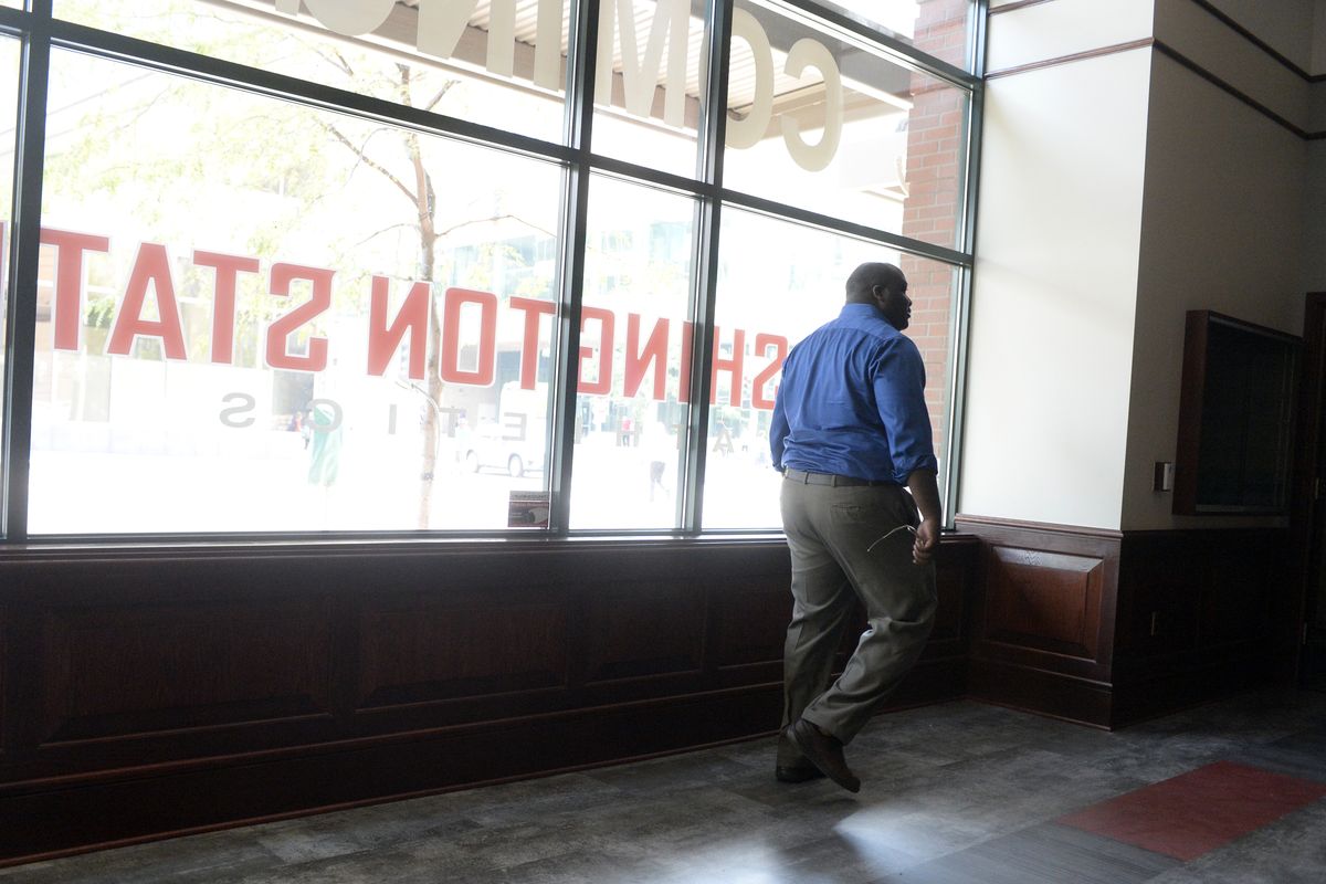 Assistant Athletic Director Devon Thomas walks Tuesday through the empty space at Riverside Avenue and Wall Street and envisions the new Washington State University store and ticket outlet that will fill it. (Jesse Tinsley)