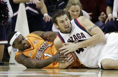 
Tennessee's Tyler Smith tries to grab the ball away from Josh Heytvelt.Associated Press
 (Associated Press / The Spokesman-Review)