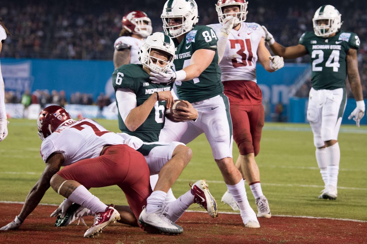 Michigan State Spartans quarterback Damion Terry (6) runs the ball in for a touchdown against WSU during the second half of the 2017 Holiday Bowl Thursday, December 28, 2017, at SDCCU Stadium in San Diego, Calif. Michigan State won the game 42-17. (Tyler Tjomsland / The Spokesman-Review)