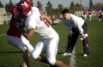 
Eastern Washington University receivers and special teams coach Keith Murphy watches a drill during practice Tuesday.
 (Holly Pickett / The Spokesman-Review)