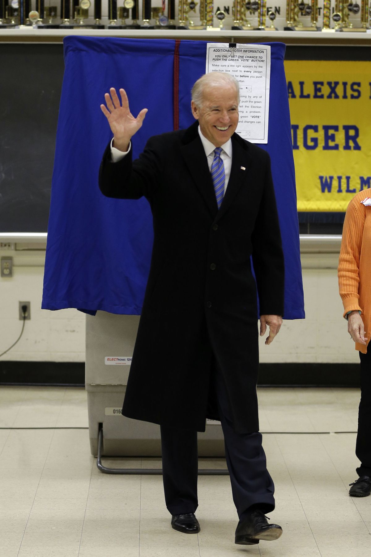 Vice President Joe Biden waves as he exits a voting booth after casting his ballot at Alexis I. duPont High School, Tuesday, Nov. 6, 2012, in Greenville, Del. (Matt Rourke / Associated Press)