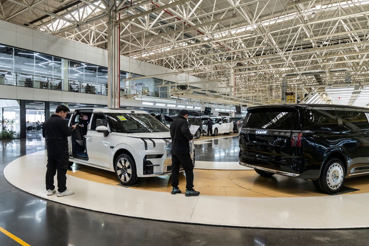 Workers operate on the vehicle assembly line of Geely Automobile’s Zeekr factory on March 31 in Ningbo, China. The Chinese government has run out of patience with companies slashing prices and is urging restraint, but fierce competition is also producing a surge of innovation. ( New York Times)