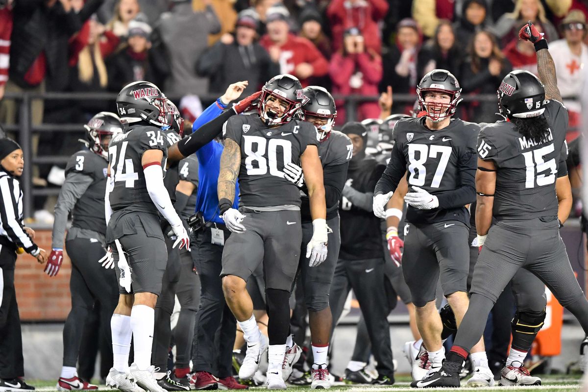 Washington State Cougars defensive end Brennan Jackson (80) reacts after he recoverd the ball and ran for a touchdown during the second half of a college football game against Colorado on Friday, Nov. 17, 2023, at Gesa Field in Pullman, Wash. WSU won the game 56-14.  (Tyler Tjomsland/The Spokesman-Review)