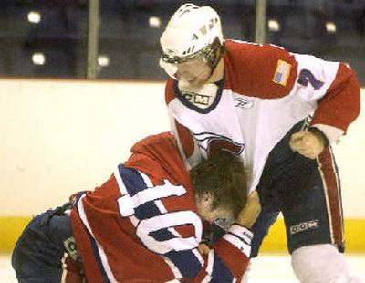 
The Spokane Chiefs' Adam Hobson, left, and Evan Haw, fight in the second period. 
 (Joe Barrentine The Spokesman Review / The Spokesman-Review)