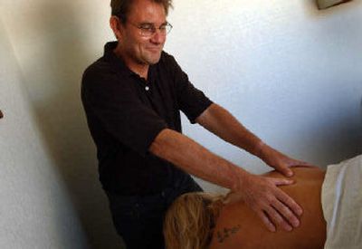 
Certified massage therapist Matt Thurley believes that cellulite can be significantly reduced through massage. 
 (Kathy Plonka / The Spokesman-Review)