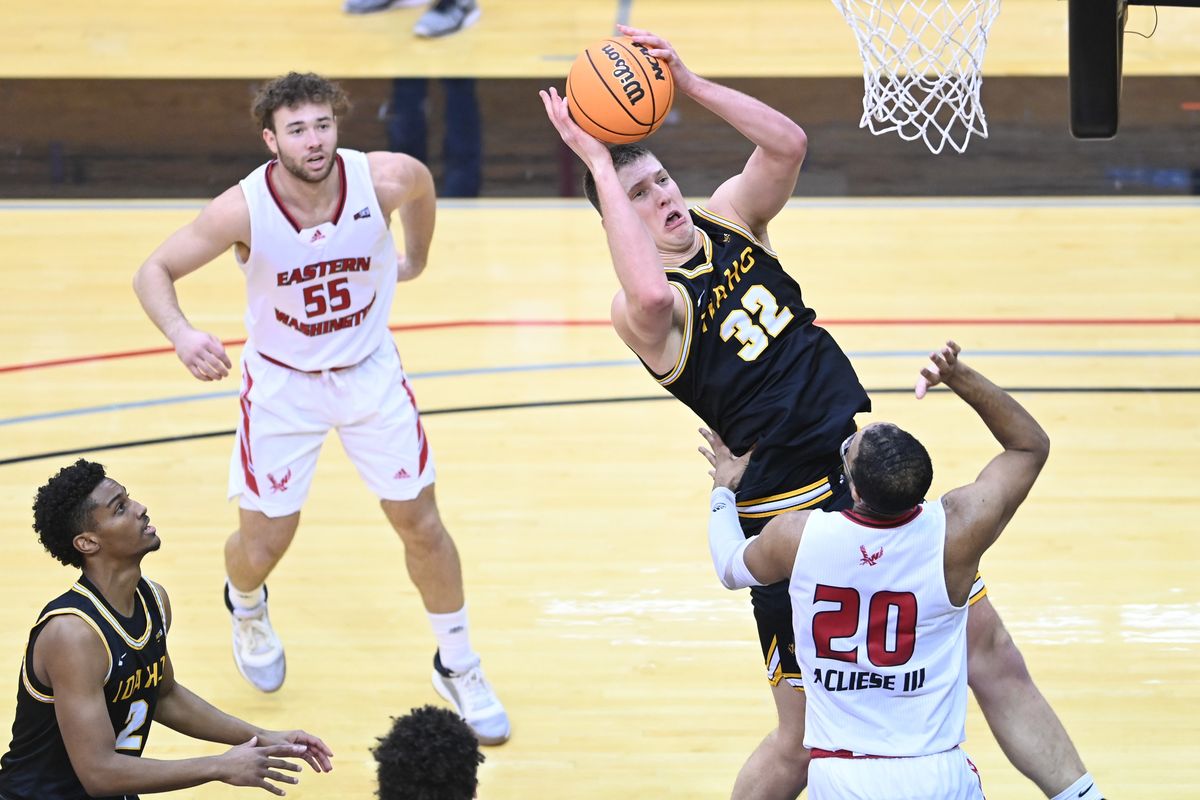 Idaho Vandals forward Tanner Christensen (32) rebounds the ball against Eastern Washington Eagles forward Linton Acliese III (20) during the first half of a college basketball game on Saturday, Jan 8, 2022, at Reese Court in Cheney, Wash.  (Tyler Tjomsland/The Spokesman-Review)