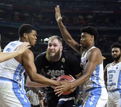 Gonzaga center Przemek Karnowski is pressured by North Carolina forward Kennedy Meeks, left, and Isaiah Hicks. (Dan Pelle / The Spokesman-Review)