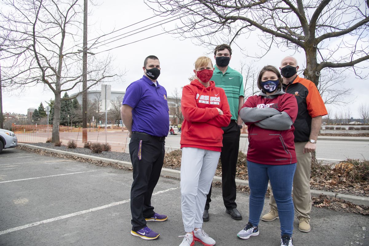 Athletic directors from five Greater Spokane League high schools gathered Monday at the site of the proposed downtown stadium. From left: Aaron Brecek, Rogers High School; Stacey Ward, Ferris High School; Beau Tilleman, Shadle Park High School; Madisen Petersen, North Central High School; Dave Hughes, Lewis and Clark High School.  (Jesse Tinsley/The Spokesman-Review)