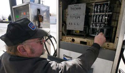 
Chip Colville, owner of Colville's Inc., checks the mechanical meters on a diesel fuel dispenser at his Chevron service station April 25 in Reardan, Wash. Associated Press
 (Associated Press / The Spokesman-Review)