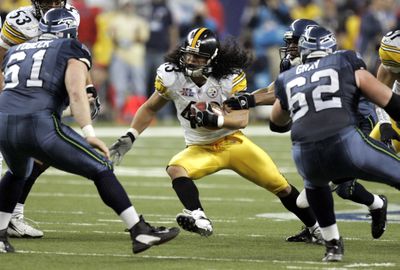 Pittsburgh Steelers safety Troy Polamalu honors his Samoan heritage by not trimming his impressive locks.  (File Associated Press / The Spokesman-Review)