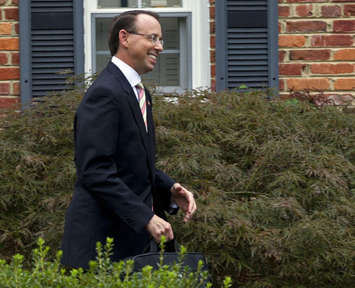 Deputy Attorney General Rod Rosenstein leaves his home on Thursday, Sept. 27, 2018 in Bethesda, Md. President Donald Trump