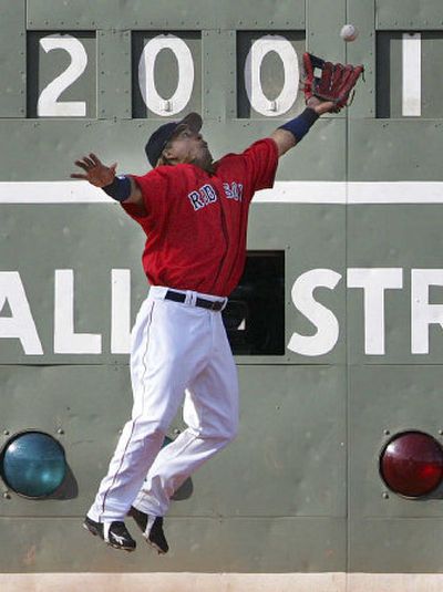 
Boston's Manny Ramirez makes the out on a fly ball by Seattle's Ichiro Suzuki in the eighth inning. 
 (Associated Press / The Spokesman-Review)