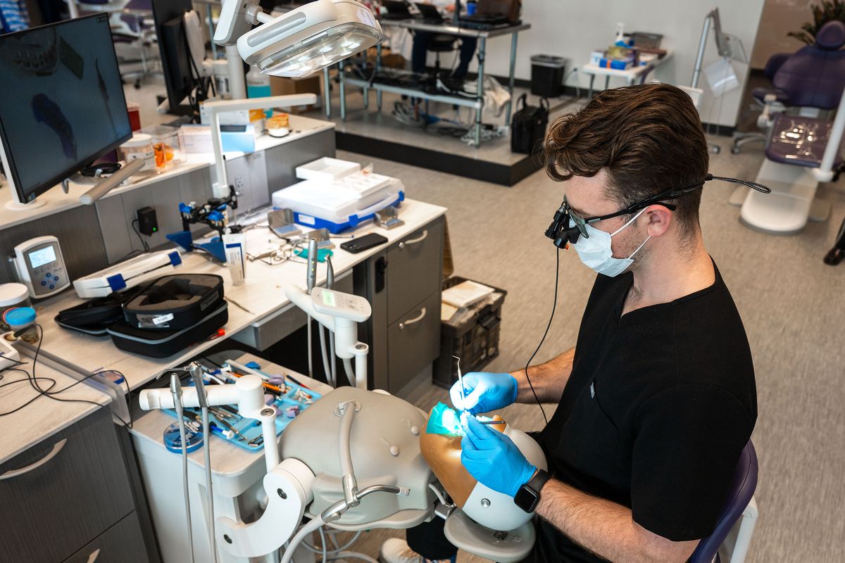 Second-year University of Washington rural dental program student Garret Lloyd works on inlay preparation in the dental simulation lab Wednesday in the UW-GU Medical School building.  (COLIN MULVANY /THE SPOKESMAN-REVIEW)